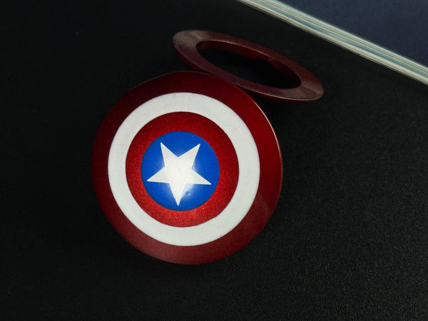 Heavy-duty star patriot alloy shield push start button cover.