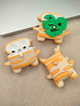 3D silicone earbud cases shaped like a woodland sprite with cream and orange fall stripes.