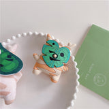 3D silicone earbud cases shaped like a woodland sprite with cream and orange fall stripes