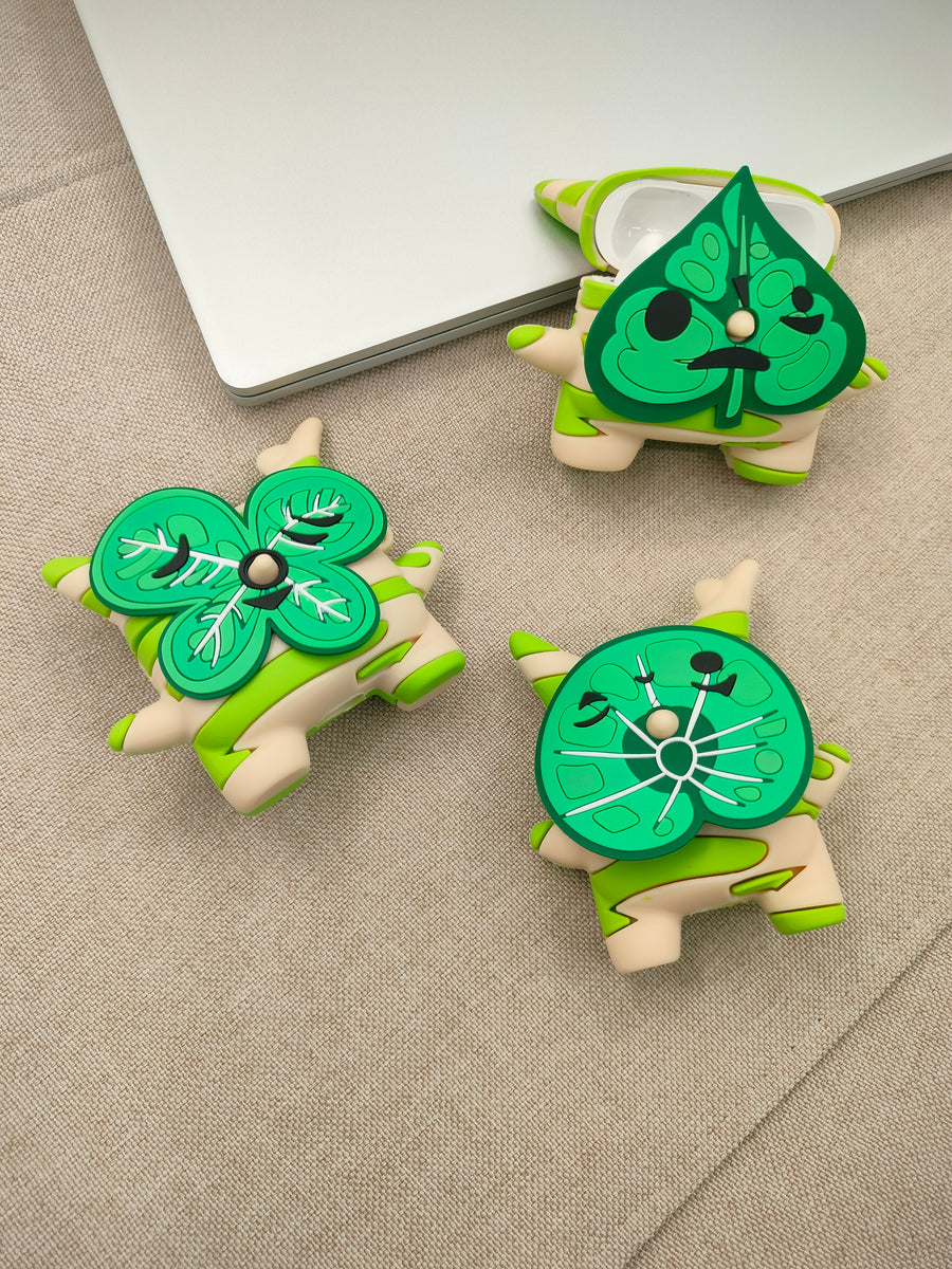 3D silicone earbud cases shaped like a woodland sprite with cream and green spring stripes.