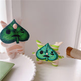 3D silicone earbud cases shaped like a woodland sprite with cream and green spring stripes.