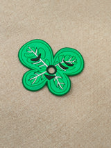 Six interchangeable green silicone leaf masks for a customizable earbud case, featuring heart, star, butterfly, and whisker shapes.