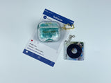 Clear earbud case filled with emerald green liquid glitter, attached to a gold cat-shaped clip and a miniature vinyl record keychain.