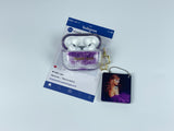 Clear earbud case filled with royal purple liquid glitter, attached to a gold cat-shaped clip and a miniature vinyl record keychain.