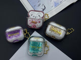 Clear earbud case filled with royal purple liquid glitter, attached to a gold cat-shaped clip and a miniature vinyl record keychain.