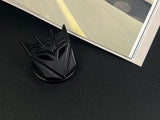 Aggressive mecha-seeker dark metal push start button cover for car interior.