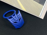 Aggressive mecha-seeker dark metal push start button cover for car interior.