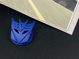 Aggressive mecha-seeker dark metal push start button cover for car interior.