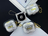 Clear earbud case filled with ghostly silver grayscale liquid glitter, attached to a gold cat-shaped clip and a miniature vinyl record keychain.