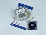Clear earbud case filled with silver-grey liquid glitter, attached to a gold cat-shaped clip and a miniature vinyl record keychain.