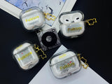 Clear earbud case filled with silver-grey liquid glitter, attached to a gold cat-shaped clip and a miniature vinyl record keychain.